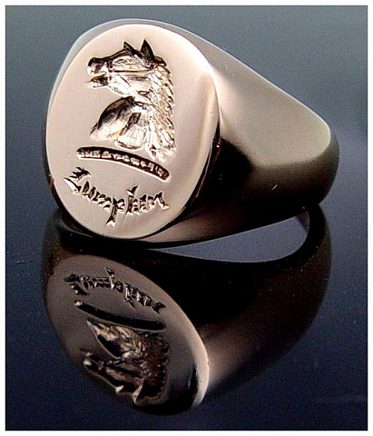 Family crest hand engraved on gold signet ring.