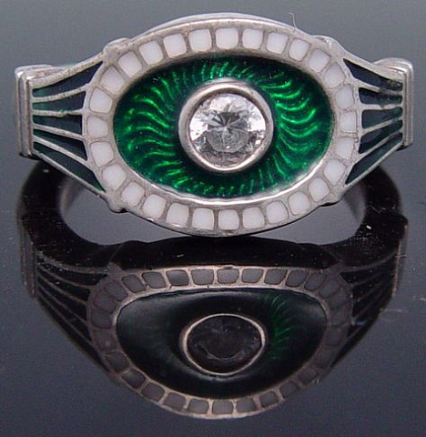 Silver ring with green-white enamels and gem