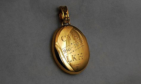 18K gold locket. Hand engraving