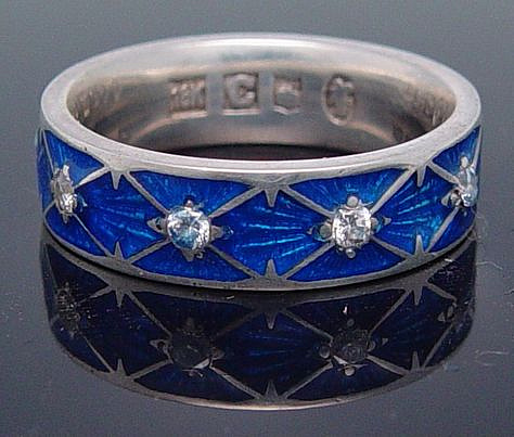 Silver wedding band with blue enamels and gems