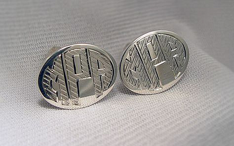 Hand engraved monogram. Silver cuff links.