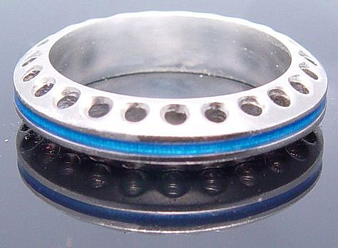 Industrial style silver ring with blue enamel.