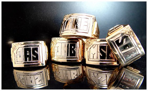 Hand engraving. Block style monograms on gold signet rings.